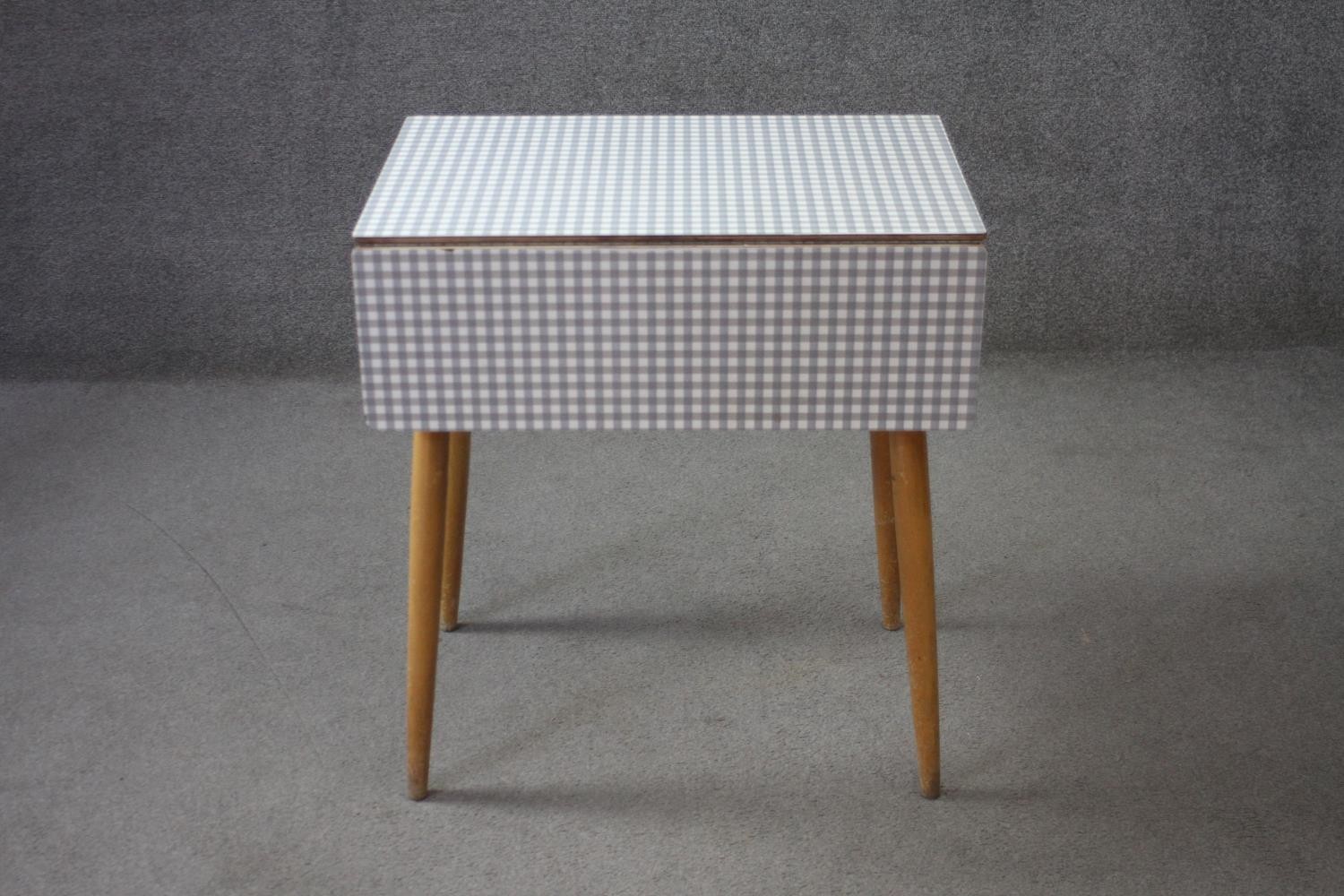 A mid century vintage drop flap kitchen table with gingham check laminated top. H.74 W.89 D.68 cm. - Image 2 of 11