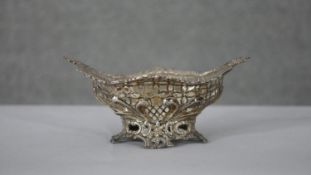 A Victorian pierced floral design silver bonbon dish with scrolling design and stylised flower