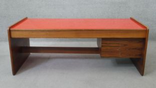 A mid century coffee table with plate glass inset top and fitted with end drinks drawer. H.53 W.