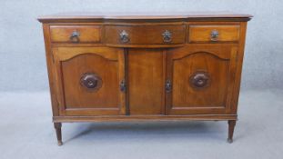 A C.1900 walnut sideboard on tapering circular section supports. H.92 W.136 D.51 cm