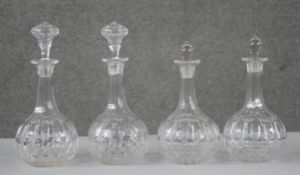 Four 19th century petal cut crystal decanters with stoppers. (two original) H.22 W.12cm (largest)