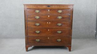 A Georgian mahogany, ebony and satinwood strung secretaire chest with fall front revealing fitted