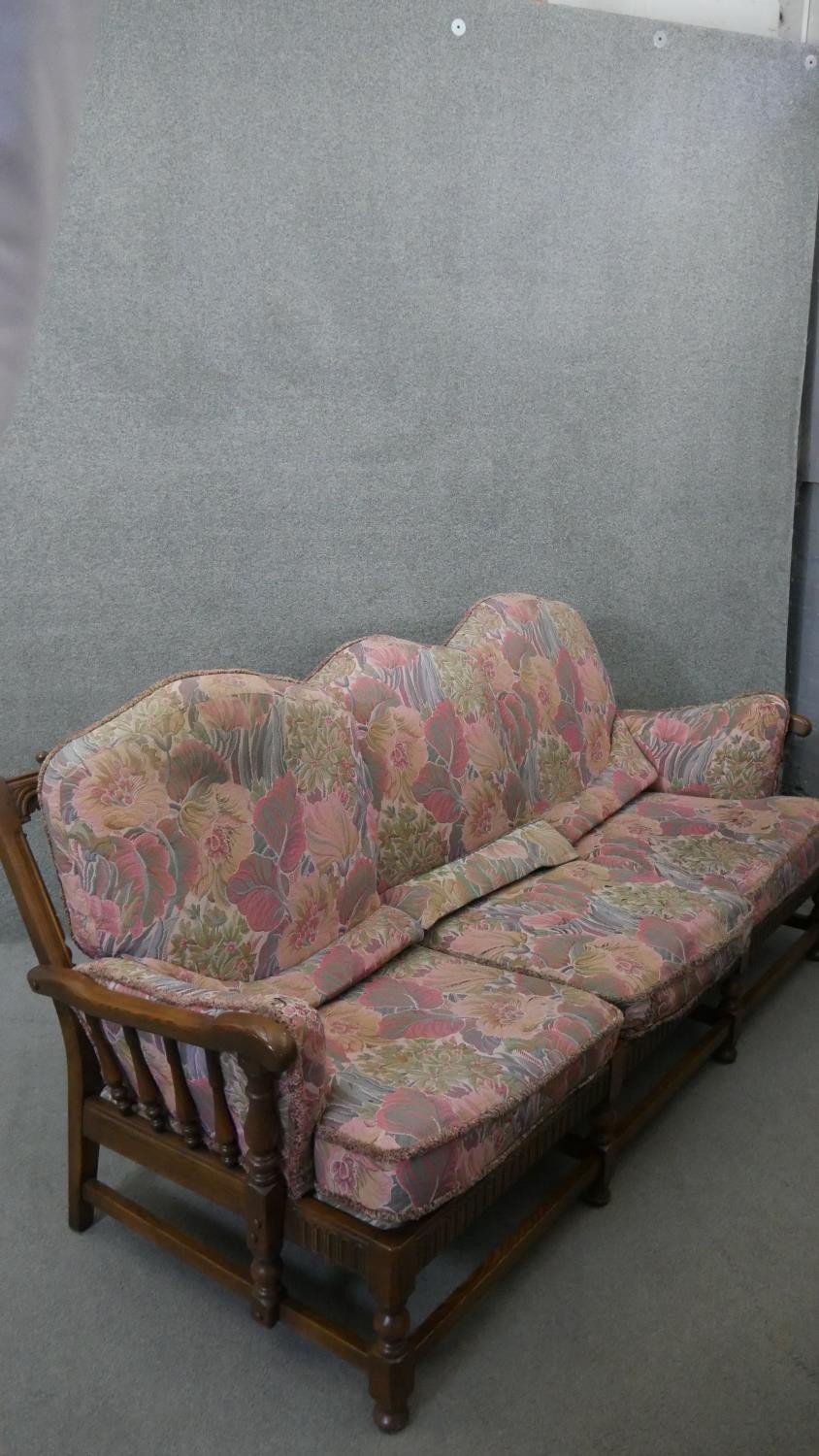 A vintage carved oak three seater sofa in the country antique style with fitted floral cushions. H. - Image 7 of 7