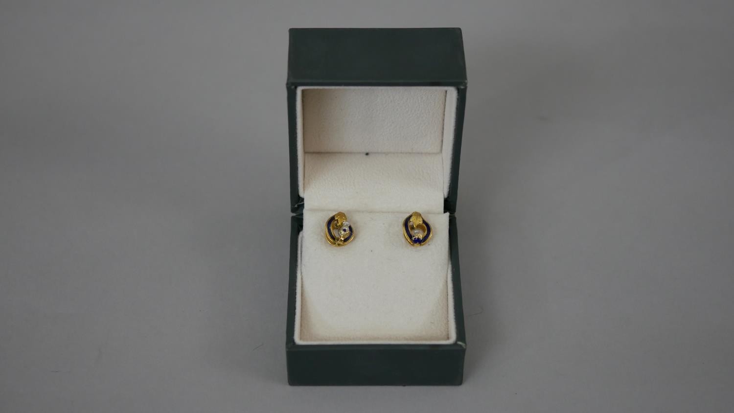 A pair of French 19th century seed pearl and blue enamel 18 carat yellow gold stud earrings.