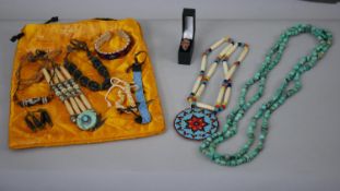 A collection of Native American jewellery. Including a long turquoise bead necklace, a coral and