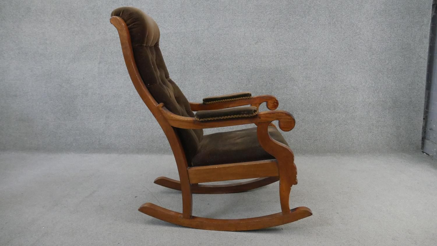 A 19th century mahogany framed rocking chair in buttoned velour upholstery. - Image 6 of 6