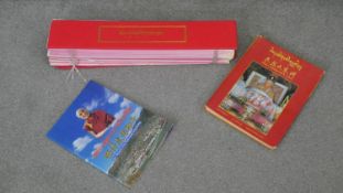 A boxed Puja prayer archive and other books on Buddhism. H.9 W.55 D.10 cm (largest)