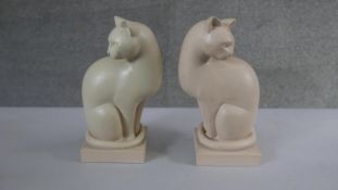 A pair of seated resin cat bookends. H.24 W.10 D.10cm