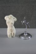 A marble effect resin torso along with a Brama chrome nude lady candlestick. H.22 W.10 cm.