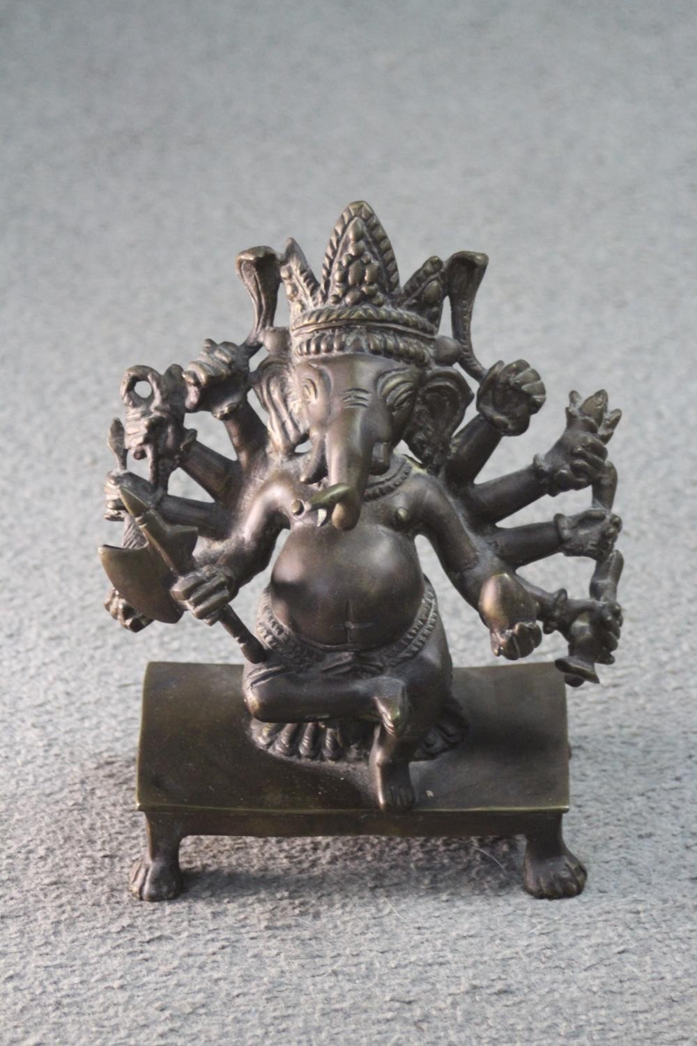 An early 20th century Eastern bronze Ganesha figure. H.24 W. 20 D.10 cm.