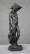 Ron Moll- A contemporary bronzed cold cast resin figure of a nude woman holding a cloth. Signed R.