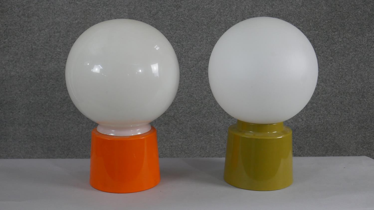 Two mid century green and orange acrylic table lamps with opaque glass white globe shades. H.34 W. - Image 2 of 5