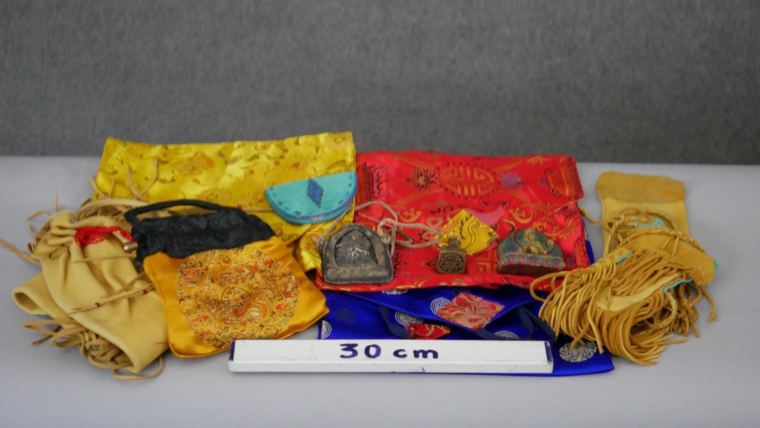 A collection of Tibetan silk bags and Buddhist items along with Native American suede bags with - Image 2 of 6