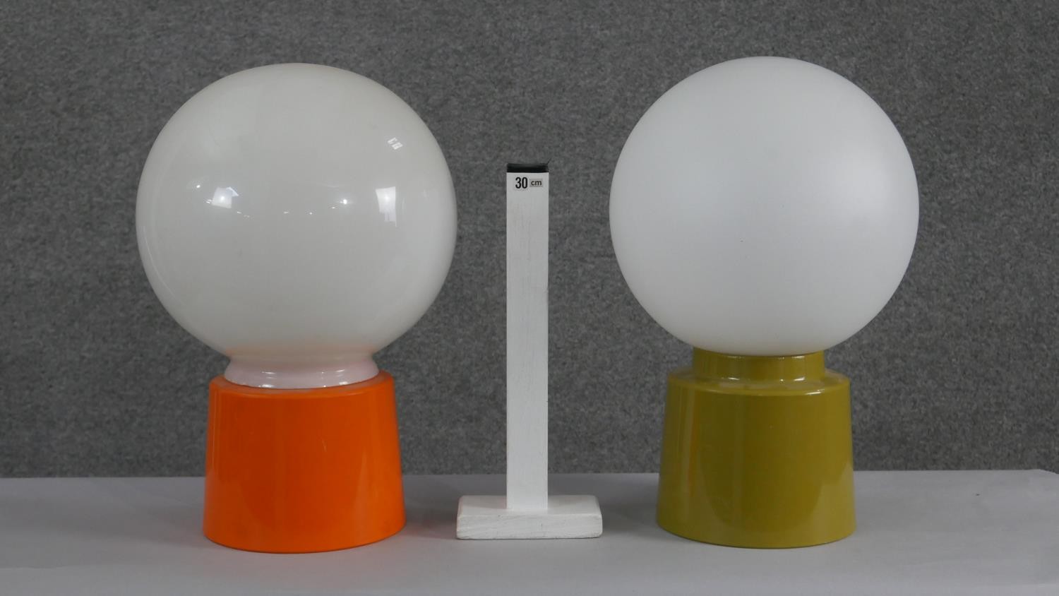 Two mid century green and orange acrylic table lamps with opaque glass white globe shades. H.34 W. - Image 5 of 5