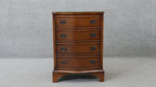 A small Georgian style flame mahogany serpentine fronted chest of drawers on shaped bracket feet.