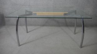 A contemporary vintage style John Lewis dining table with plate glass top on brushed chrome base.