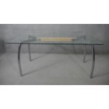 A contemporary vintage style John Lewis dining table with plate glass top on brushed chrome base.