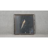 A framed and glazed 19th century stump work panel of a bird in a tree with gold thread detailing.
