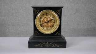 An early 20th century lacquered iron Ansonia mantle clock with gilt metal dial, gilded details and