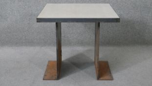 A metal framed industrial style table with composite laminated top. H.50 D.55 W.55 cm