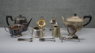 A collection of silver plated items. Including a candle snuffer and wick cutters, two coal scuttle