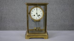 A 19th century French gilt brass and bevelled plate mercury pendulum mantle clock with white