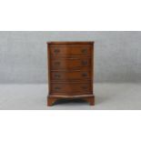 A small Georgian style flame mahogany serpentine fronted chest of drawers on shaped bracket feet.