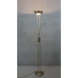 A brushed chrome dimming uplighter with adjustable reading light arm. H.179 W.75cm