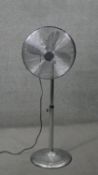 A contemporary retro styled floor standing chromium fan with adjustable height and speed settings.