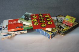 A collection of vintage toys and games. Including Cluedo, Beetle, Dont Miss the Boat, Go and a