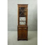 A Georgian style mahogany and satinwood strung narrow library bookcase. H.180 W.53 D.33 cm.