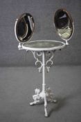 A 19th century wrought iron dressing table with twin bevelled and adjustable vanity mirrors above