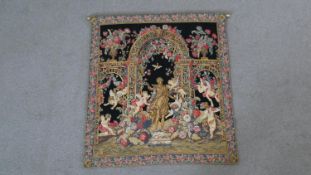 A very fine Aubusson woven tapestry of Classical design with cherubs and a floral arch with brass