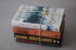 A collection of four books. Including Joshua's Hammer by David Hagberg, Vellum by Hal Duncan (