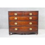 A 19th century mahogany chest of drawers with shaped apron and bracket feet resting on casters. H.88