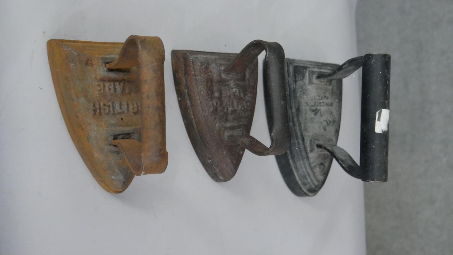 A collection of six irons and two sets of shop scales, one by Royal. H.13 W.28 D.17cm (largest) - Image 3 of 7
