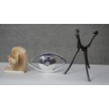 An Art Deco alabaster table lamp along with a chrome eye and African hardwood giraffe bowl stand.