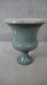 A large 19th century carved green marble pedestal urn with fluted rim. (some damage to base). H.53