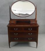 An Edwardian mahogany and satinwood inlaid dressing table with bevelled swing mirror. H.156 W.96 D.