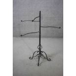 A Victorian style cast iron revolving towel rail with scrolling design base. H.102 W.106 D.40 cm.