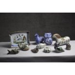 A collection of eleven Tonala Mexican ceramic animals and a plate. Nine pieces by Ken Edwards and