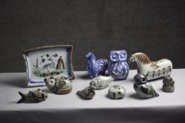 A collection of eleven Tonala Mexican ceramic animals and a plate. Nine pieces by Ken Edwards and