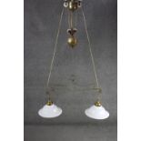A French brass rise and fall ceiling light with original opaque white glass shades. H.100 W.70cm