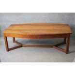 A contemporary American cherrywood refectory style dining table of bowed outline on square cross