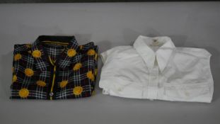 Two vintage shirts. One Hermes white cotton sleeveless shirt along with a Burberry silk tartan and