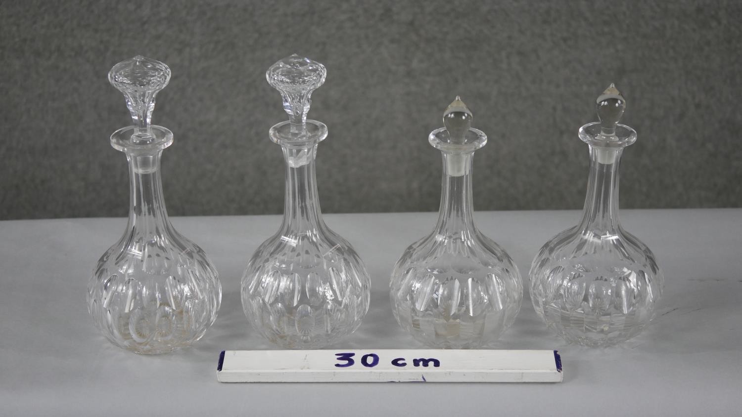 Four 19th century petal cut crystal decanters with stoppers. (two original) H.22 W.12cm (largest) - Image 6 of 6