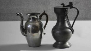 A large 18th century style lidded pewter tankard with rams head detailing along with a silver plated