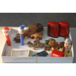 A collection of vintage toys. Including Pez dispensers, two miniature tin plate post boxes with