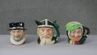 A collection of three Royal Doulton hand painted ceramic toby jugs. Including Beefeater, Sarah