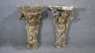 A pair of Classical style figural gilt plaster wall brackets with mermaid mythical aquatic figure